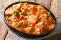 MafeÃÂ is a famous and popular West African dish cooked chicken in spicy peanut sauce close-up in a plate. horizontal